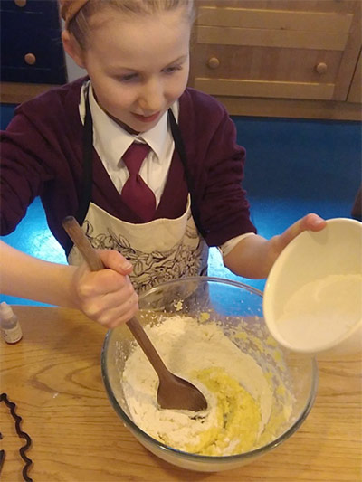 Mixing the dough for bat biscuits